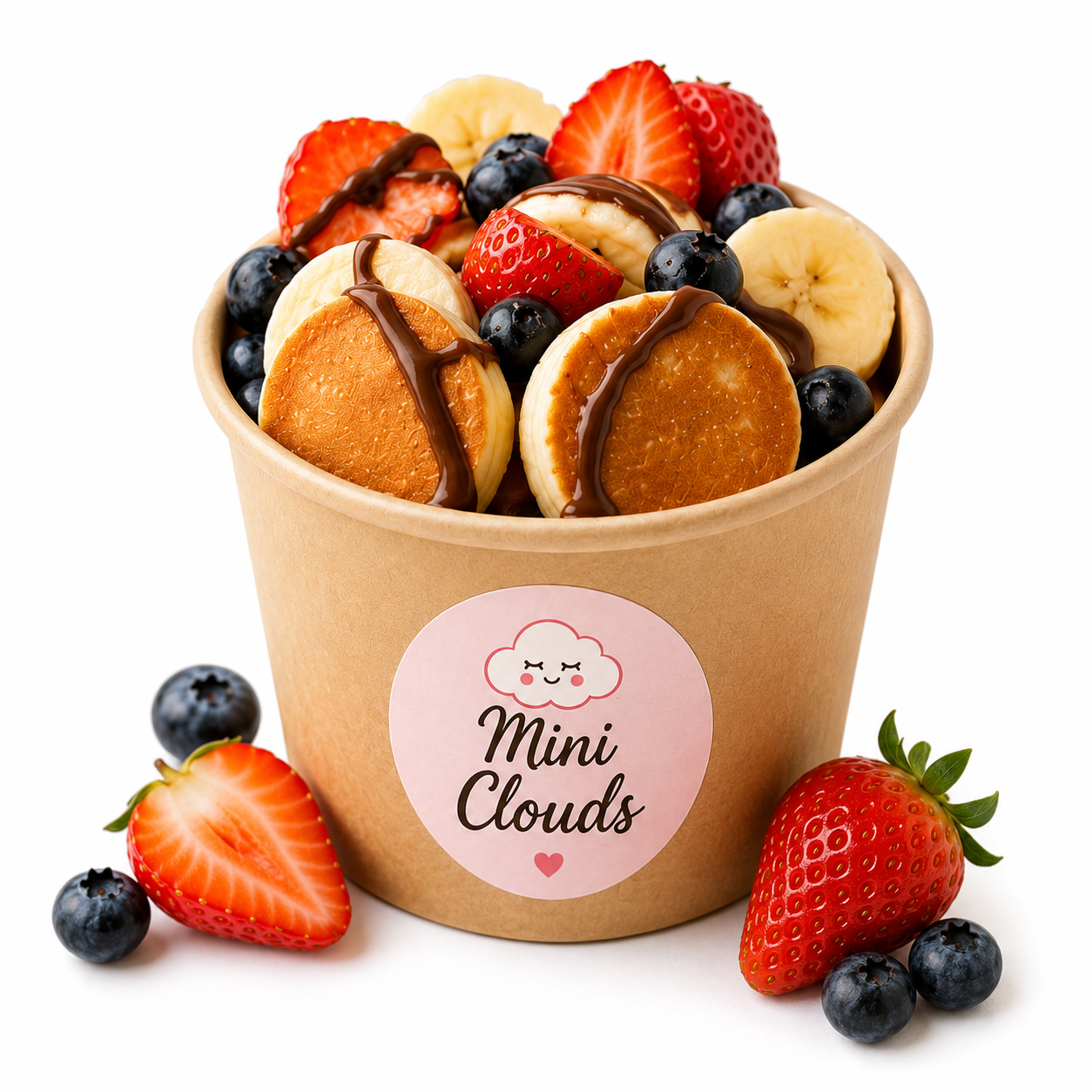 Mini Clouds mini pancakes served in a cup with fresh strawberries and blueberries